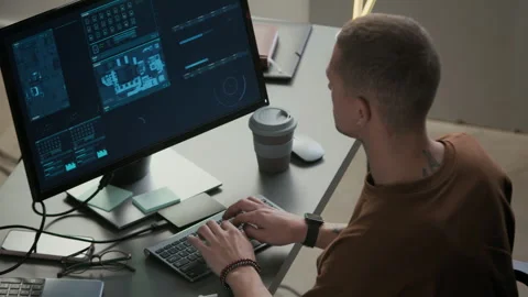 Young Male Programmer Working on PC at Desk in Night Office Stock Footage 292632089