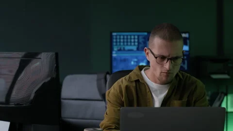 Young Male Programmer Working with Program Coding in Dark Office Stock Footage 292621667