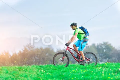 A young male riding a mountain bike outdoor Stock Photos