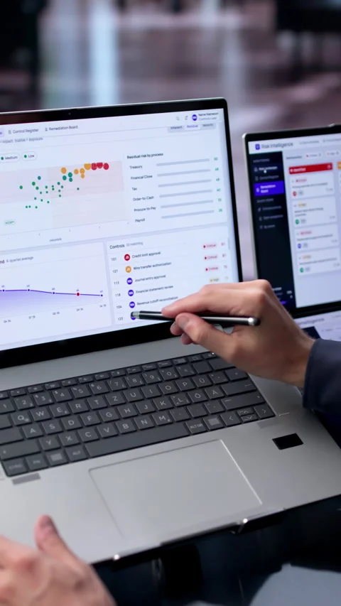 Young Male Risk Manager Uses Dual Touchscreen Laptops Stock Footage 342965908