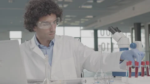 Young male scientist doing sample research in the laboratory. Stock Footage 137924500