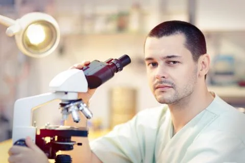 Young Male Scientist with Microscope Stock Photos