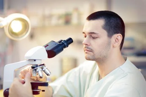 Young Male Scientist with Microscope Stock Photos