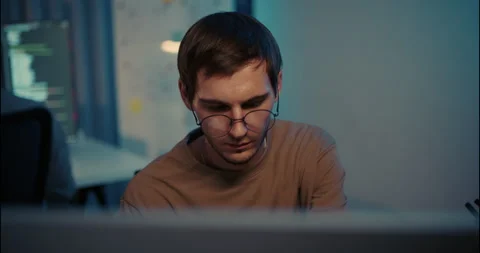 Young Male Software Developer Concentrating on Computer Screen. Stock Footage 306739867