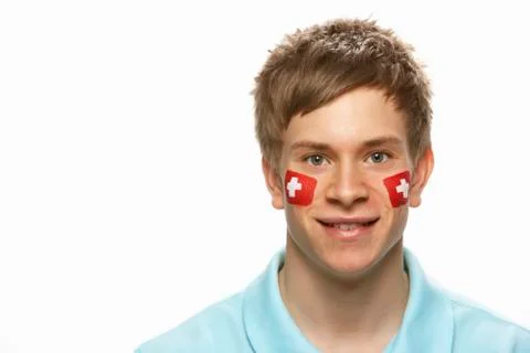 Young Male Sports Fan With Swiss Flag Painted On Face Stock Photos