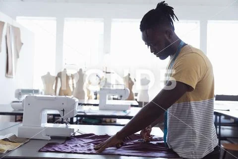Young male student working on a project at a fashion college Stock Photos