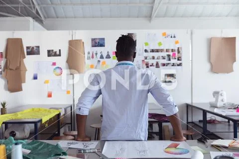 Young male student working on a project at a fashion college Stock Photos