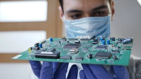 Young Male Tech or Engineer Repairs Electronic Equipment Video stock 106380763