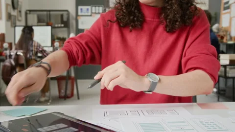 Young Male User Interface Designer Working with Wireframe Prototypes at Desk Stock Footage 327905179