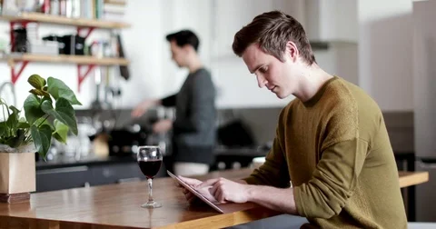 Young male using digital tablet at home Stock Footage 85209831