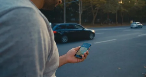 Young male using gps navigation in the street. Stock Footage 115769825
