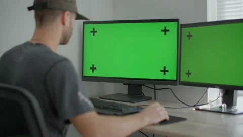 Young male working at home on computer, green screen mockup 库存影片 218466932