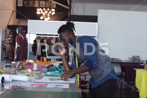 Young male working on a project at a fashion college Stock Photos