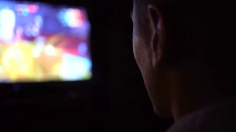 Young Man Absorbed In Online Video Game at night. Man watching TV Stock Footage 73736732