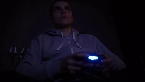 Young Man Absorbed In Online Video Game at night. Controller, console, gamepad 스톡 동영상 73752202