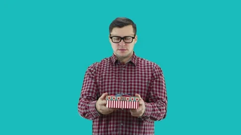 A young man  accepts a New Year's gift, opens the box and there is money. Stock Footage 133185359