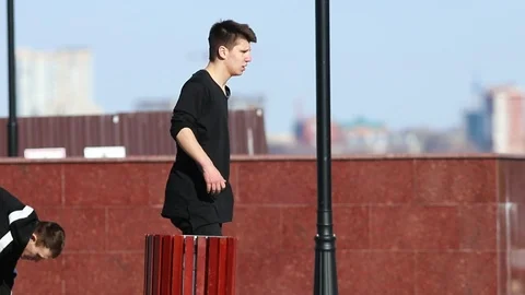 Young man acrobatic man about to perform a parkour trick Stock Footage 106859755