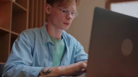 Young man actively typing on the laptop, working from home Vídeo Stock 164373112