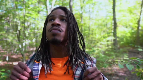 Young Man Adjusting Backpack While in Nature Stock Footage 142017986