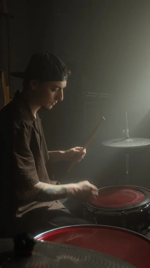 Young Man Adjusting Snare Drum and Checking Sound in Dark Music Studio Stock Footage 338403730