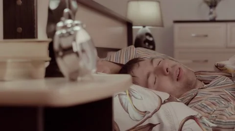 Young man almost wakes up while having a nightmare Stock-Footage 68421522