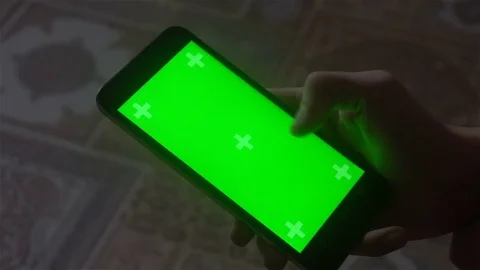 A young man and a green screen smartphone Stock Footage 82135187
