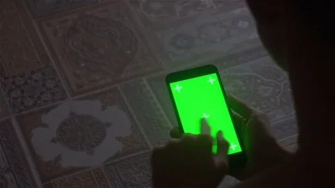 A young man and a green screen smartphone Stock Footage 82136599
