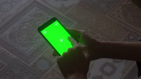 A young man and a green screen smartphone Stock Footage 82137968