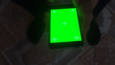 A young man and a green screen smartphone Stock Footage 82146045