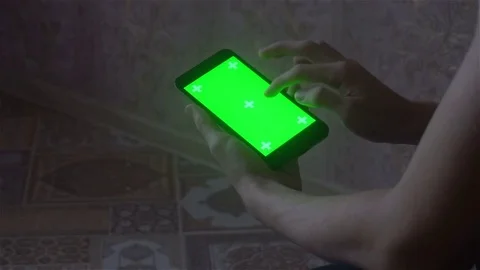 A young man and a green screen smartphone Stock Footage 82146982