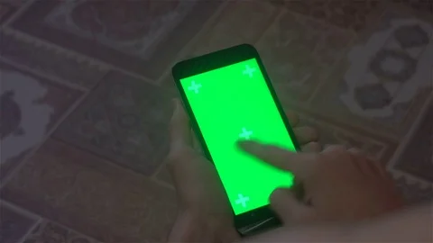 A young man and a green screen smartphone Stock Footage 82147306
