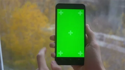 A young man and a green screen smartphone Stock Footage 82148876
