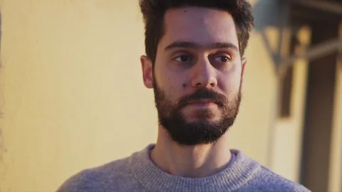 Young Man and his shadow, on Rooftop of a building, on yellow background , Sl Stock Footage 106671601