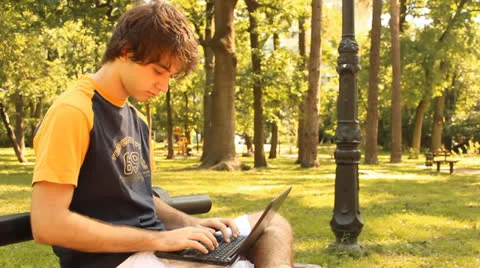 Young man and laptop Stock Footage 24766412