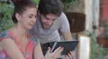young man and woman are having fun surfing the internet with tablet HD Footage