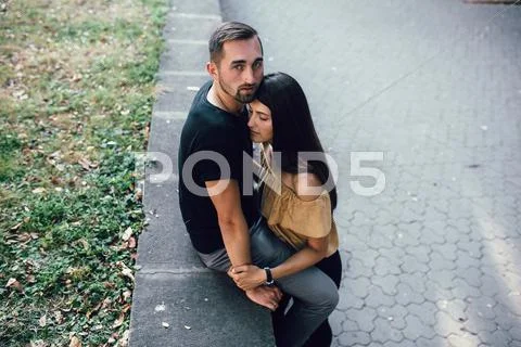 Young man and woman in the park Stock Photos