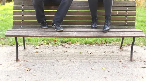 Young man and women playing guitar and singing in park Stock Footage 59556880