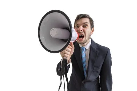 Young man is announcing a message and shouting to megaphone 스톡 사진