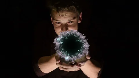 Young man appears to open a portal. Stock Footage 110305925