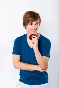 Young man with a apple Stock Photos