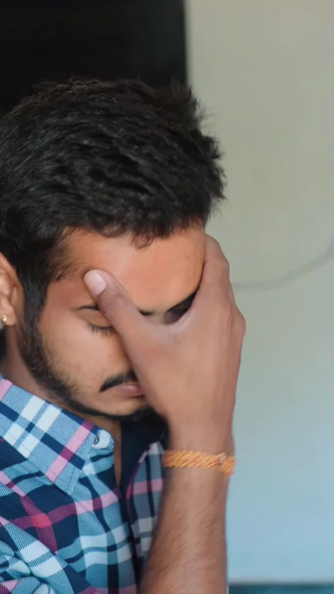 Young Man Applying Balm on Head for Headache Relief – Pain and Stress Stock Footage 332655316
