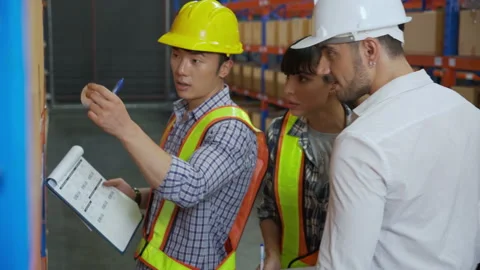 Young man applying shipping label to packaging and check document and manager Video stock 209742962