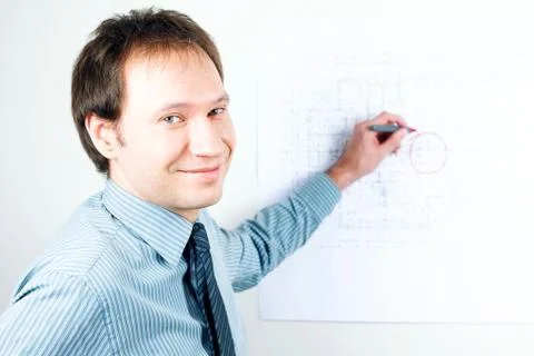Young man architect presenting a project Stock Photos