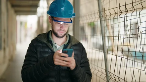 Young man architect using smartphone at street Stock Footage 172053739