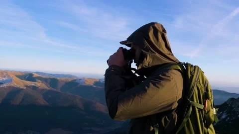 A young man in army looking through binoculars. Stock Footage 164997571