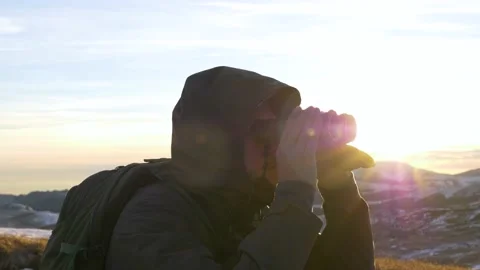 A young man in army looking through binoculars. Stock Footage 164998417