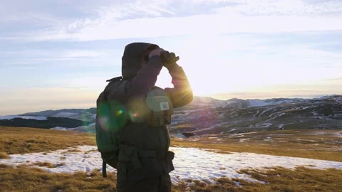 A young man in army looking through binoculars. Stock Footage 164998587