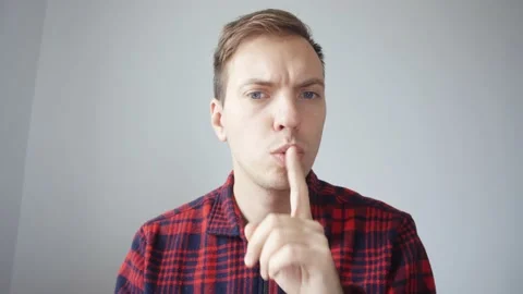 The young man asks to speak more quietly, because they are sleeping next to him. Stock-Footage 231574102