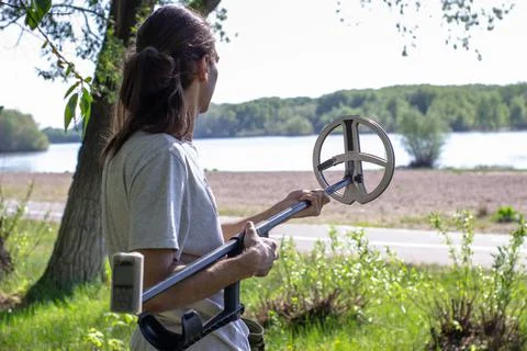 Young man assembling a foldable wireless metal detector Stock Photos