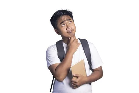 Young man with a backpack holding a notebook while resting his chin on his .. Stock Photos